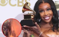 sza hit by bracelet thrown by fan while meeting crowd in new viral video