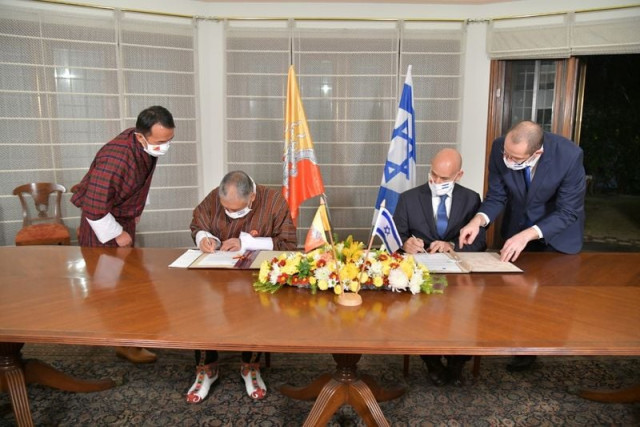 the israeli and bhutanese ambassadors to india sign an agreement during a signing ceremony for the establishment of diplomatic relations between israel and bhutan in the israeli embassy in new delhi india december 12 2020 courtesy israeli embassy in new delhi handout via reuters the israeli and bhutanese ambassadors to india sign an agreement during a signing ceremony for the establishment of diplomatic relations between israel and bhutan in the israeli embassy in new delhi india december 12 2020 courtesy israeli embassy in new delhi handout via reuters