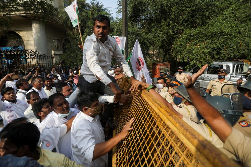 demonstrators attempt to cross a police barricade during a protest of farmers and members of various agricultural against new farm laws passed by india s parliament in mumbai india december 22 2020 reuters