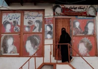 a woman wearing a niqab enters a beauty salon where the ads of women have been defaced by a shopkeeper in kabul afghanistan october 6 2021 reuters jorge silva file photo