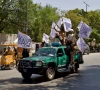 members of the taliban carrying flags participate in a rally to mark the third anniversary of the fall of kabul in kabul afghanistan august 14 2024 photo reuters