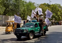members of the taliban carrying flags participate in a rally to mark the third anniversary of the fall of kabul in kabul afghanistan august 14 2024 photo reuters