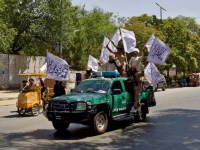 members of the taliban carrying flags participate in a rally to mark the third anniversary of the fall of kabul in kabul afghanistan august 14 2024 photo reuters