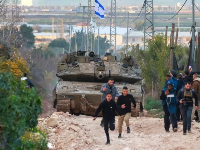 palestinian children and journalists disperse as israeli tanks enter the jenin camp for palestinian refugees in the occupied west bank photo afp palestinian children and journalists disperse as israeli tanks enter the jenin camp for palestinian refugees in the occupied west bank photo afp
