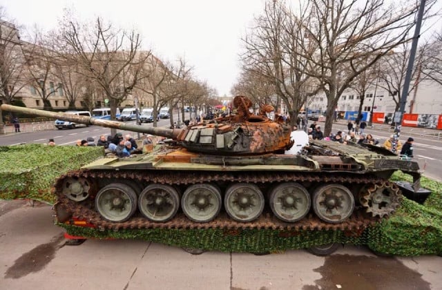 the remains of a destroyed russian t 72 tank secured from the ukrainian village of dmytrivka outside kyiv are on display near the the brandenburg gate during an event to mark the one year anniversary of the russian invasion of ukraine in berlin germany february 24 2023 photo reuters