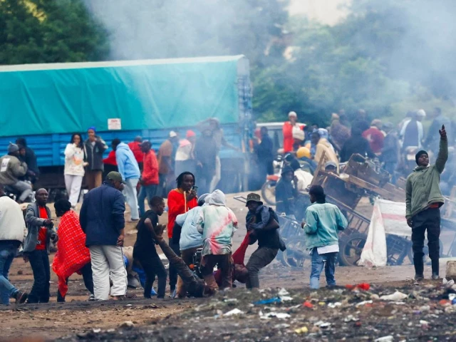 demonstrators carry the dead body of a man killed during a protest a day after a general election marred by violent demonstrations over the exclusion of two leading opposition candidates at the namanga one post border crossing point between kenya and tanzania as seen from namanga kenya october 30 2025 photo reuters
