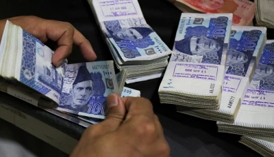 an employee counts pakistani rupee notes at a bank in peshawar pakistan august 22 2023 photo reuters