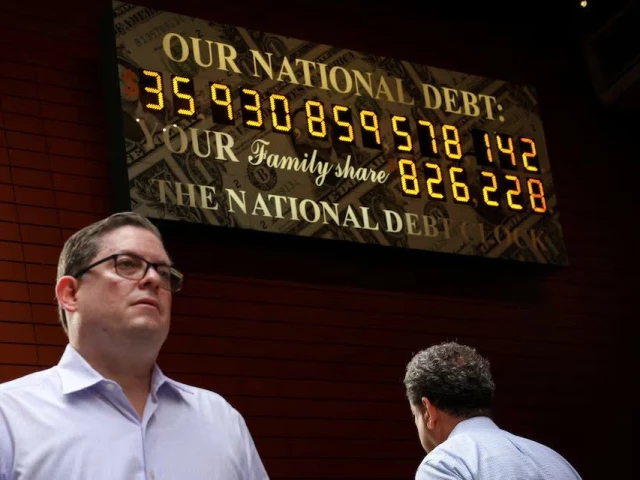 people pass by the national debt clock in new york city u s july 1 2025 photo reuters