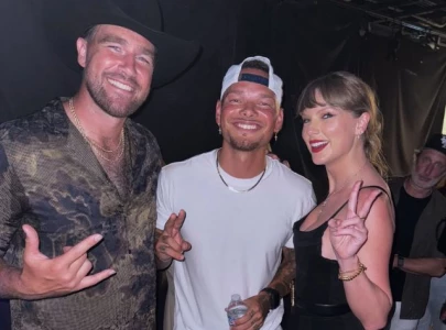 taylor swift upstages kane brown at kelce s show and he s loving it