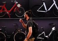 a man walks past bikes on display at a booth at the eurobike 2026 fair in frankfurt photo kirill kudryavtsev afp