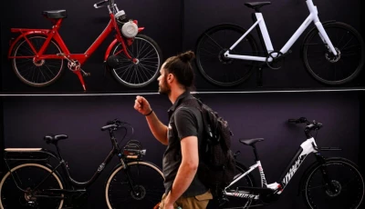 a man walks past bikes on display at a booth at the eurobike 2026 fair in frankfurt photo kirill kudryavtsev afp