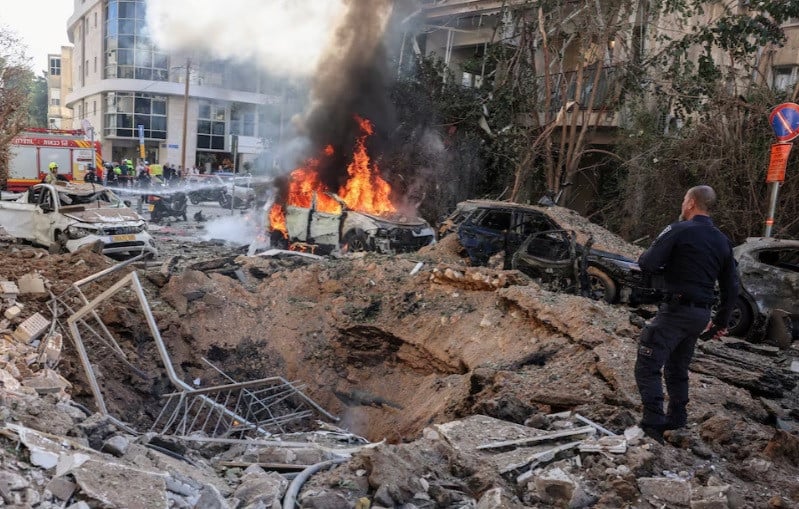 Emergency personnel respond at a site following Iranian missile barrages in Tel Aviv. PHOTO: REUTERS