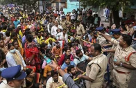 devotees gather to collect entrance tokens to visit the venkateswara swamy temple in tirupati district of india s andhra pradesh jan 8 2025 photo afp