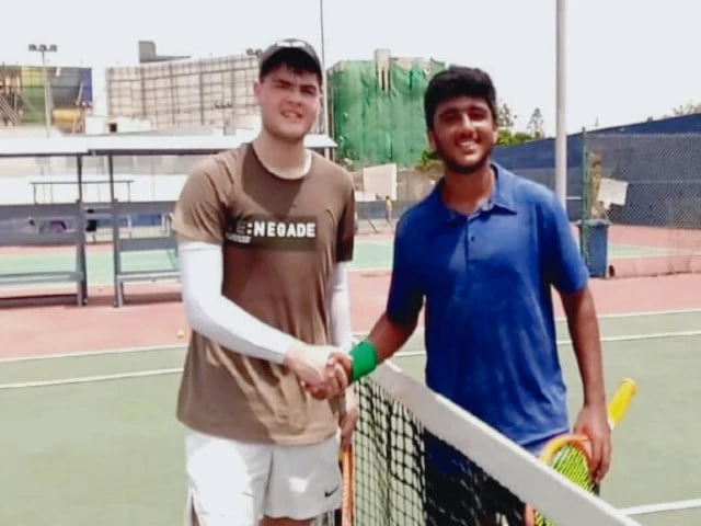 ruhab faisal is seen with his opponent ibrahim parvez after their second round clash in isdin tennis championship on sunday photo kta ruhab faisal is seen with his opponent ibrahim parvez after their second round clash in isdin tennis championship on sunday photo kta