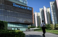a man walks past the tencent headquarters in shenzhen in china s southern guangdong province photo afp