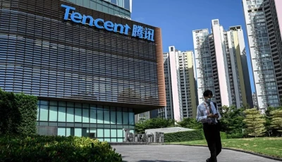 a man walks past the tencent headquarters in shenzhen in china s southern guangdong province photo afp