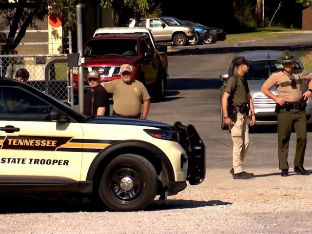 law enforcement officers guard a gate outside the accurate energetic systems military explosives plant after an explosion at the facility in bucksnort tennessee u s october 10 2025 in a still image from video photo reuters