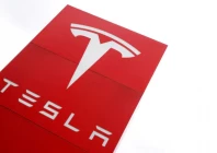 the logo of car manufacturer tesla is seen at a dealership in london britain may 14 2021 reuters