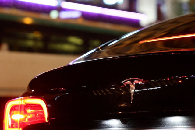 a tesla logo is seen on a parisian taxi car in paris france december 14 2021 photo reuters a tesla logo is seen on a parisian taxi car in paris france december 14 2021 photo reuters