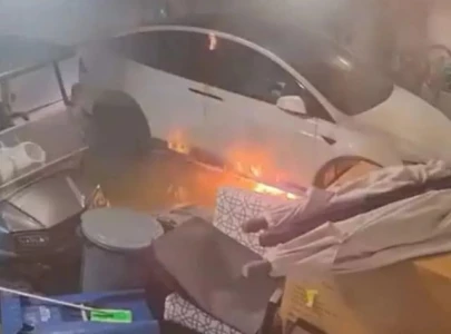 tesla bursts into flames in garage during hurricane helene leaving florida family homeless watch tesla bursts into flames in garage during hurricane helene leaving florida family homeless watch