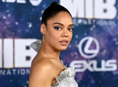 tessa thompson says chris hemsworth is like a baby with muscles after thor collaboration