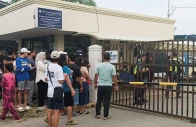 people stand outside ateneo de zamboanga university after a shooting that killed two people in zamboanga southern philippines august 18 2026 photo reuters
