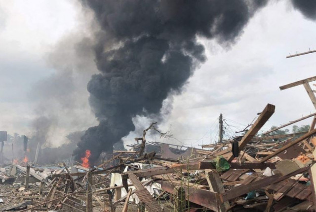 thick smoke rises from the rubble following a fireworks explosion that killed at least nine people and injured dozens more in sungai kolok district of narathiwat on saturday afternoon photo courtesy radio thailand thick smoke rises from the rubble following a fireworks explosion that killed at least nine people and injured dozens more in sungai kolok district of narathiwat on saturday afternoon photo courtesy radio thailand