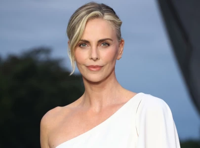 charlize theron talks the old guard 3 hopes the odyssey role and mad max fury road making of film