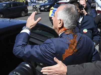 red liquid thrown at iranian opposition figure reza pahlavi during germany visit