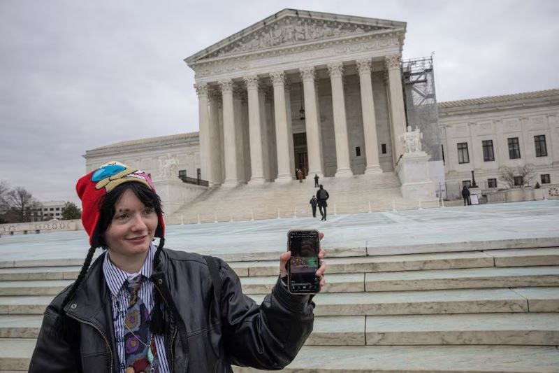 A woman shows her TikTok feed in front of the US Supreme Court in Washington, US, January 17, 2025. PHOTO: REUTERS