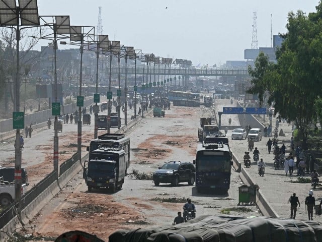 Police personnel patrol a street following crackdown on TLPactivists during an anti-Israel protest in Muridke on October 13. Photo: AFP