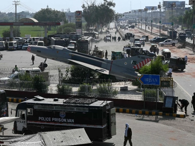 police personnel patrol a street following crackdown on tlp activists during an anti israel protest in muridke on october 13 photo afp