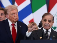 us president donald trump looks at prime minister shehbaz sharif speaking following the official signing of the first phase of the gaza ceasefire agreement in sharm el sheikh egypt on october 13 2025 photo reuters