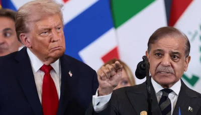 us president donald trump looks at prime minister shehbaz sharif speaking following the official signing of the first phase of the gaza ceasefire agreement in sharm el sheikh egypt on october 13 2025 photo reuters