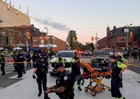 police officers stand guard as emergency workers respond at the site of a deadly shooting at a salsa themed street festival in toronto ontario canada july 11 2026 photo reuters