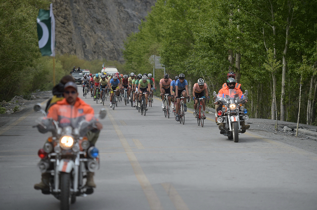 In this picture taken on June 30, 2019, Pakistani and international cyclists take part in the Tour de Khunjerab, one of the world's highest altitude cycling competitions, near the Pakistan-China Khunjerab border. PHOTO: AFP