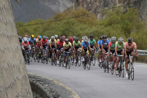 In this picture taken on June 30, 2019, Pakistani and international cyclists take part in the Tour de Khunjerab, one of the world's highest altitude cycling competitions, near the Pakistan-China Khunjerab border. PHOTO: AFP