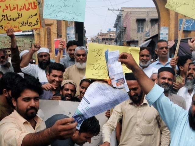chanting slogans against the government protesters held banners and electricity bills photo express file