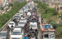 karachi s battered roads trigger backache among bikers karachi s battered roads trigger backache among bikers