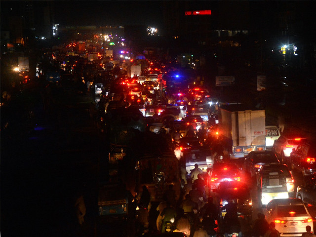 Vehicles stuck in traffic jam on Korangi Road during light rain. Photo: Jalal Qureshi/Express