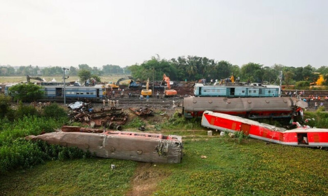 heavy machinery removes damaged coaches from the railway tracks at the site of a train collision following the accident in balasore district in the eastern state of odisha india june 4 2023 photo reuters heavy machinery removes damaged coaches from the railway tracks at the site of a train collision following the accident in balasore district in the eastern state of odisha india june 4 2023 photo reuters