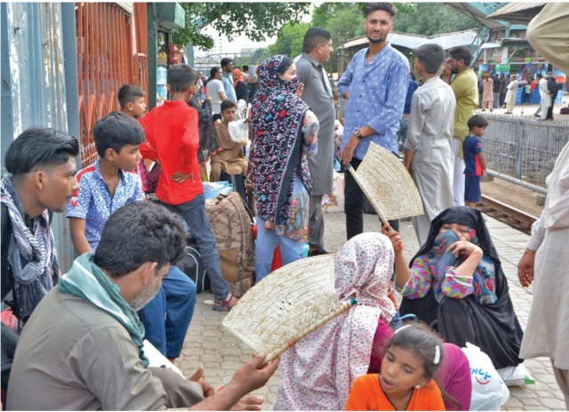stranded passengers wait for their train at karachi cantt station train timings have been disrupted due to flooding of tracks following rains in the province photo jalal qureshi express stranded passengers wait for their train at karachi cantt station train timings have been disrupted due to flooding of tracks following rains in the province photo jalal qureshi express