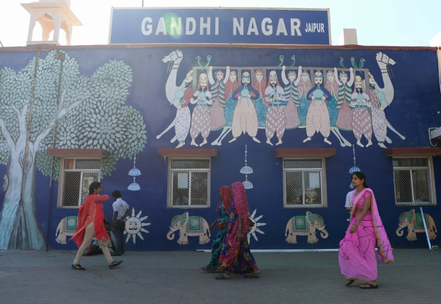 Indian women walk outside the Gandhinagar railway station in Jaipur. Gandhinagar is India's only interstate train station run entirely by women. PHOTO: AFP