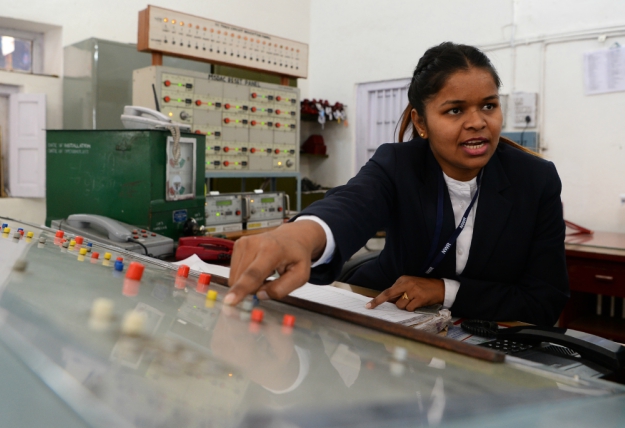 Station supervisor Neelam Jatav explains the panel used for tracking trains at Gandhinagar railway station in Jaipur. PHOTO: AFP