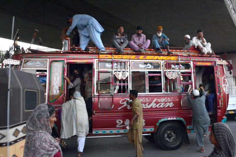 like a can of sardines people get on an already overloaded wagon at qayumabad bus stop in karachi during the evening rush hour photo jalal qureshi express