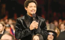 trump threatens lawsuit against grammy host