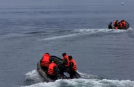 rescue team members use rubber boats during a search operation for missing passengers in simalungun north sumatra indonesia photo reuters