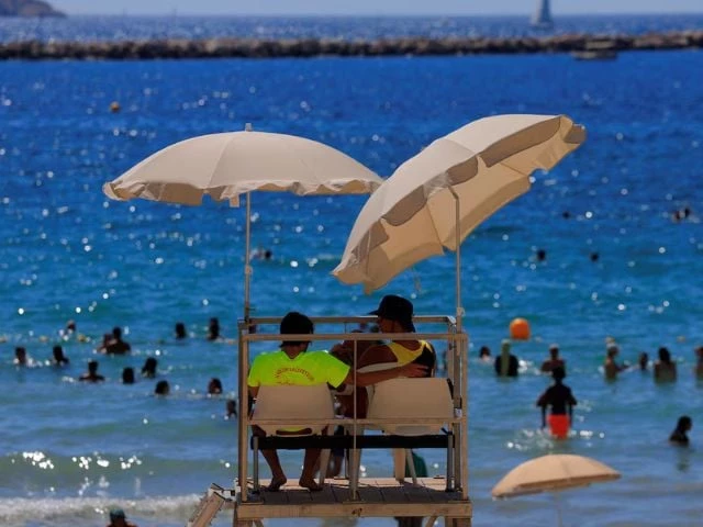 lifeguards watch beachgoers as they bathe at the beach of catalans on a sunny and warm summer day in marseille as an early summer heatwave hits france july 1 2025 reuters manon cruz lifeguards watch beachgoers as they bathe at the beach of catalans on a sunny and warm summer day in marseille as an early summer heatwave hits france july 1 2025 reuters manon cruz