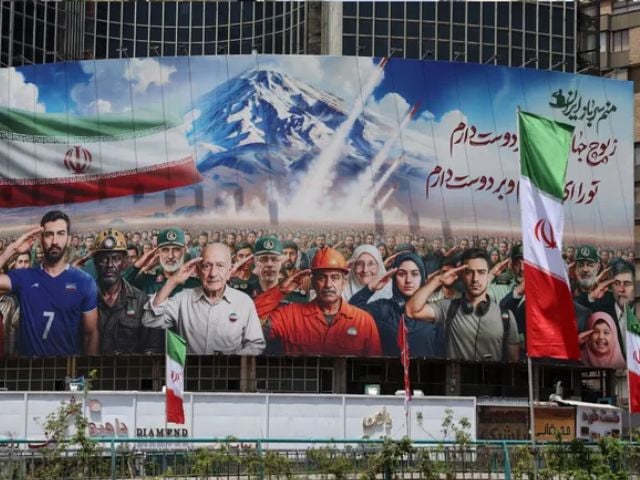 A banner bearing a painting that represents various categories of the Iranian society is deployed against the facade of a building in Tehran, with a message that reads in Farsi: 