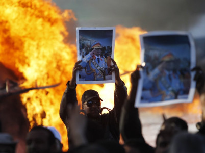 fighting back qaddafi forces seize eastern town